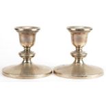 Pair of sterling silver circular dwarf candlesticks, 9cm high, 488.8g : For further information on