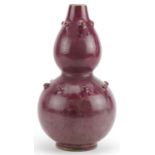 Chinese porcelain double gourd vase having a red glaze, 25cm high : For further information on