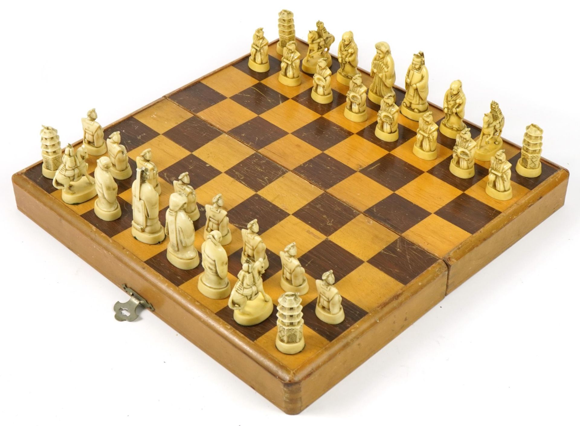 Chinese ivorine chess set housed in a fitted folding chess board, the chess board 39cm x 40cm :