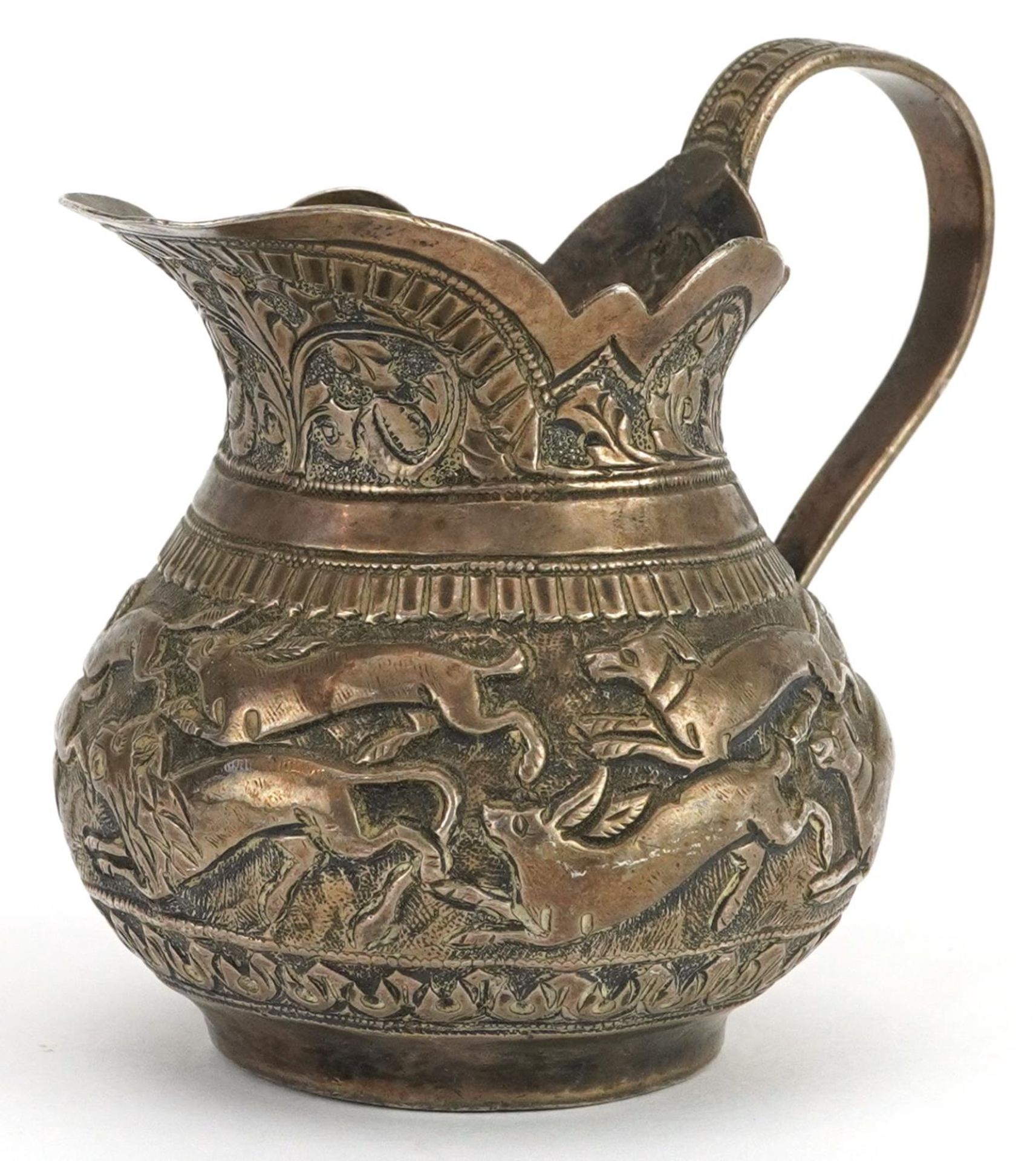 Anglo Indian unmarked silver cream jug embossed with wild animals, 7cm high, 101.8g : For further