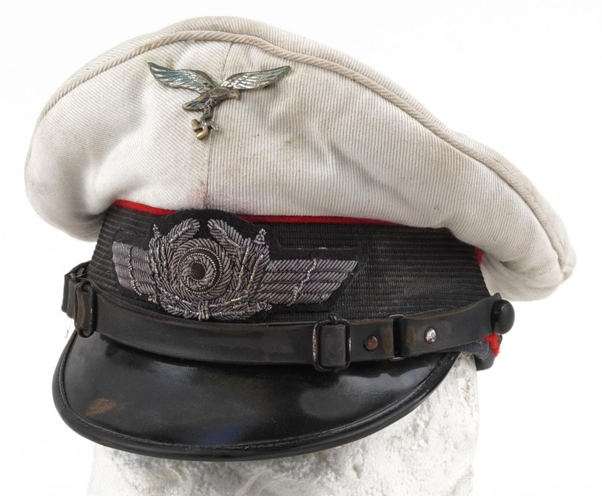 German military interest peak cap with badges : For further information on this lot please visit