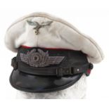 German military interest peak cap with badges : For further information on this lot please visit