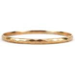 Large 9ct gold metal core bangle, 8.5cm in diameter, 27.0g : For further information on this lot