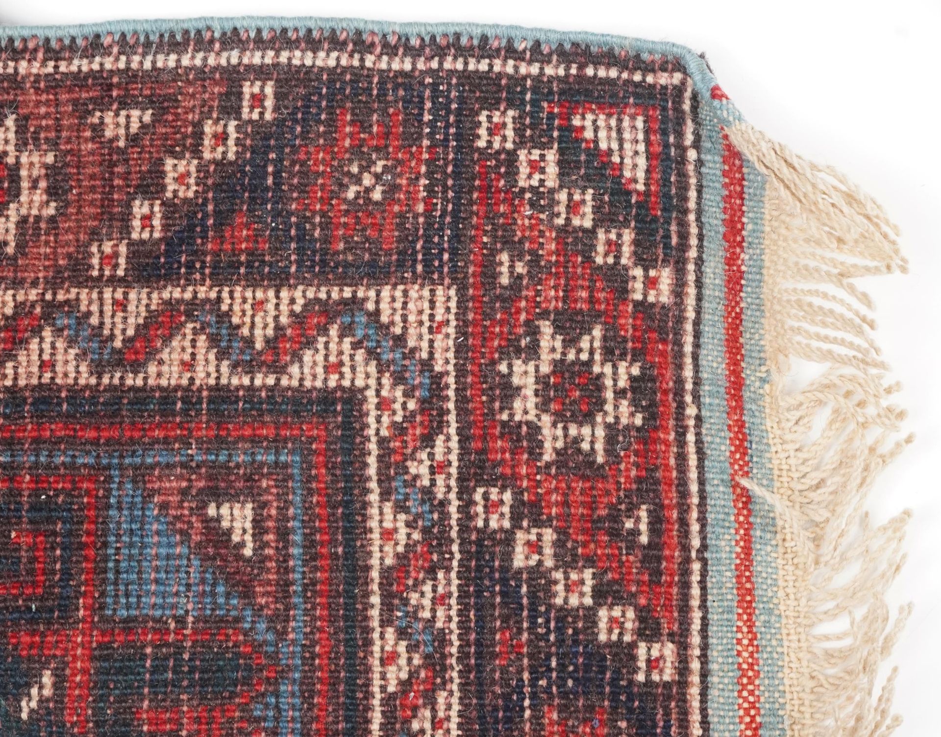 Turkish Red and blue ground carpet runner having an allover repeat geometric design, 295cm x - Image 5 of 5