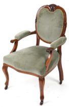 Victorian style armchair with olive green upholstery on cabriole legs with casters, 95cm high :