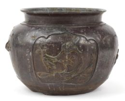 Japanese patinated bronze jardiniere decorated in relief with birds of paradise, 27cm in