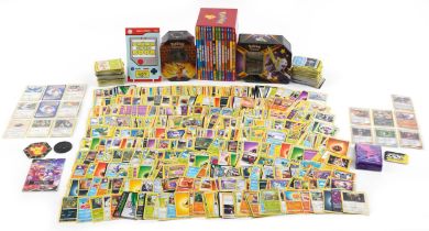 Large collection of Pokemon trade cards, some holographic, with two collector's tins and Orchard