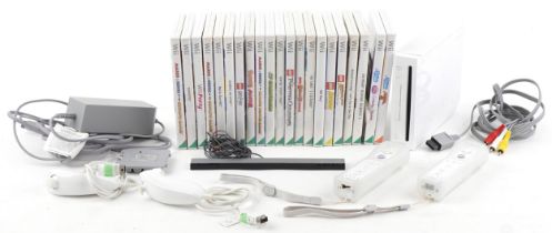 Nintendo Wii games console with controllers, accessories and a collection of games : For further