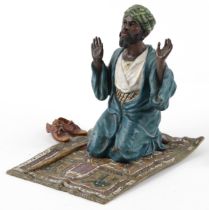 Manner of Franz Xaver Bergmann, cold painted bronze of an Arab praying, 15cm in length : For further