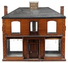 Large antique scratch built wooden doll's house with various glass panels and brass carrying