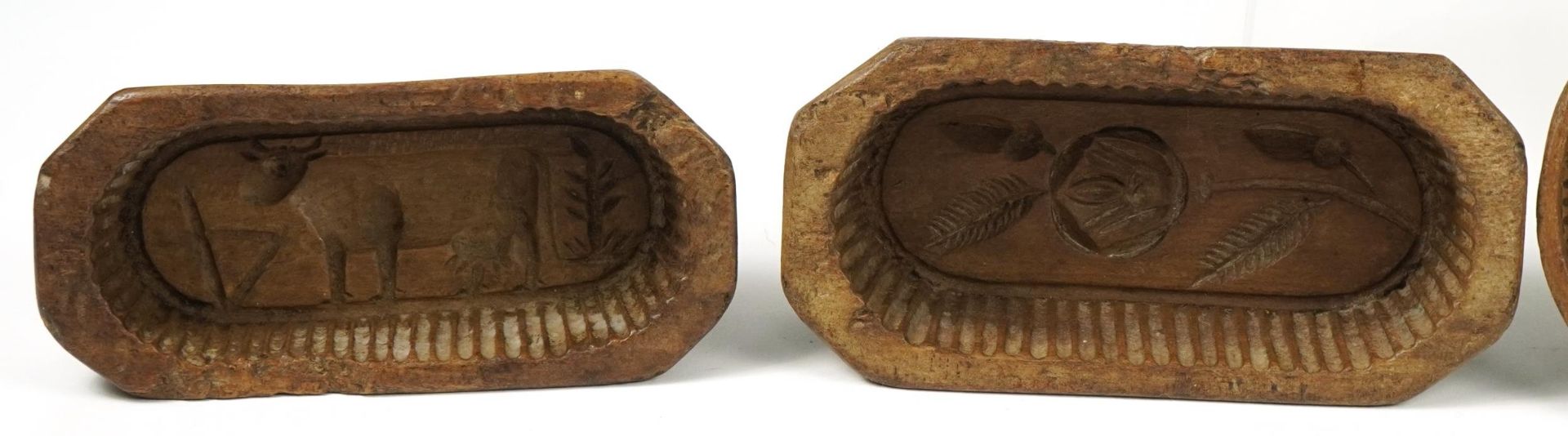 Six Antique French treen butter moulds including examples carved with flowers, the largest 20.5cm in - Image 2 of 5