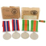 Four British military World War II medals with two boxes of issue : For further information on