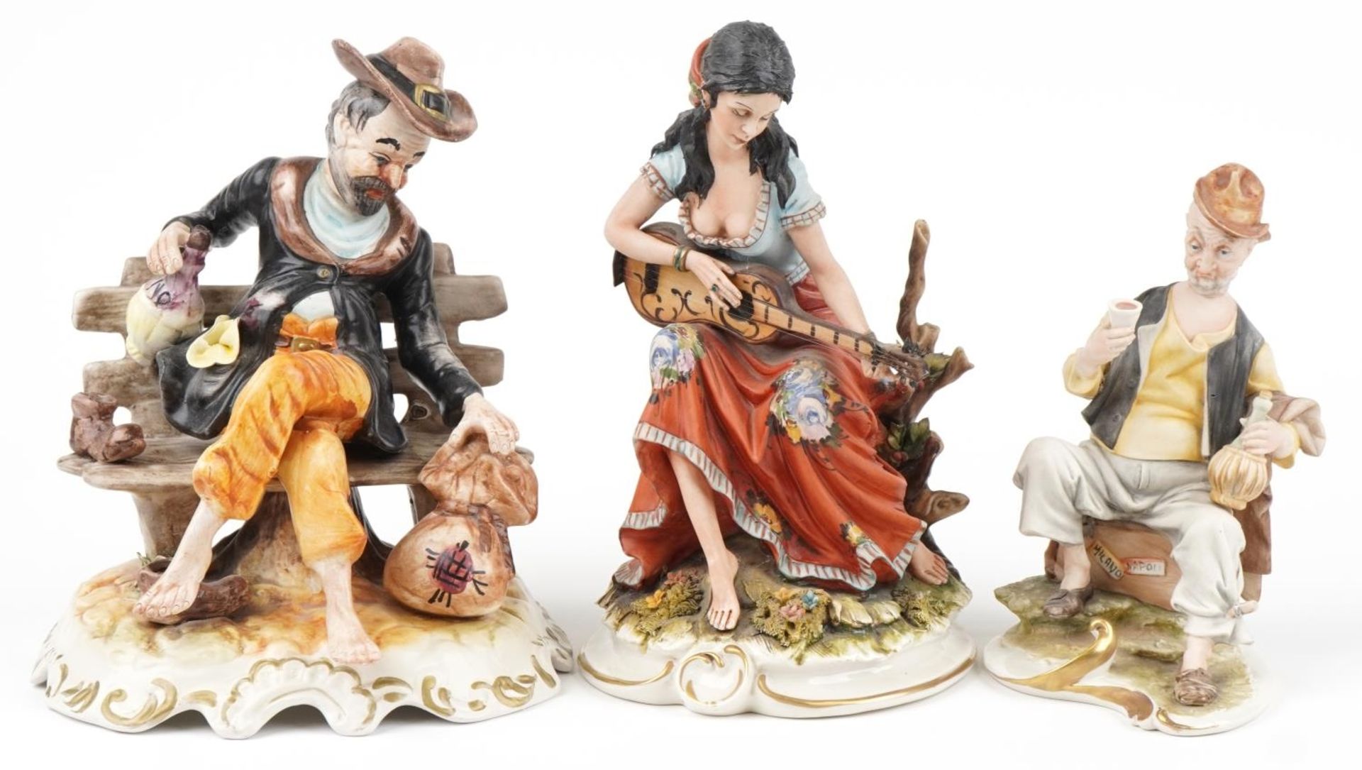 Three Capodimonte figurines including a female musician, the largest 29.5cm high : For further