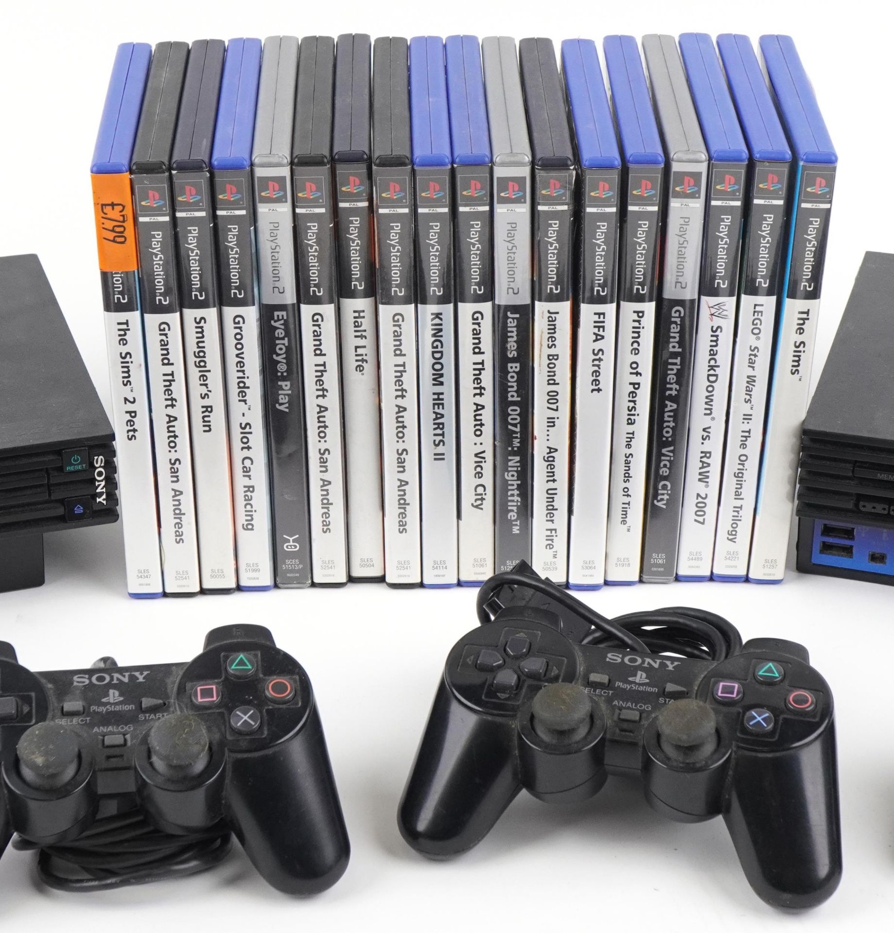 Two Sony PlayStation 2 games consoles with controllers and a collection of games : For further - Image 3 of 4