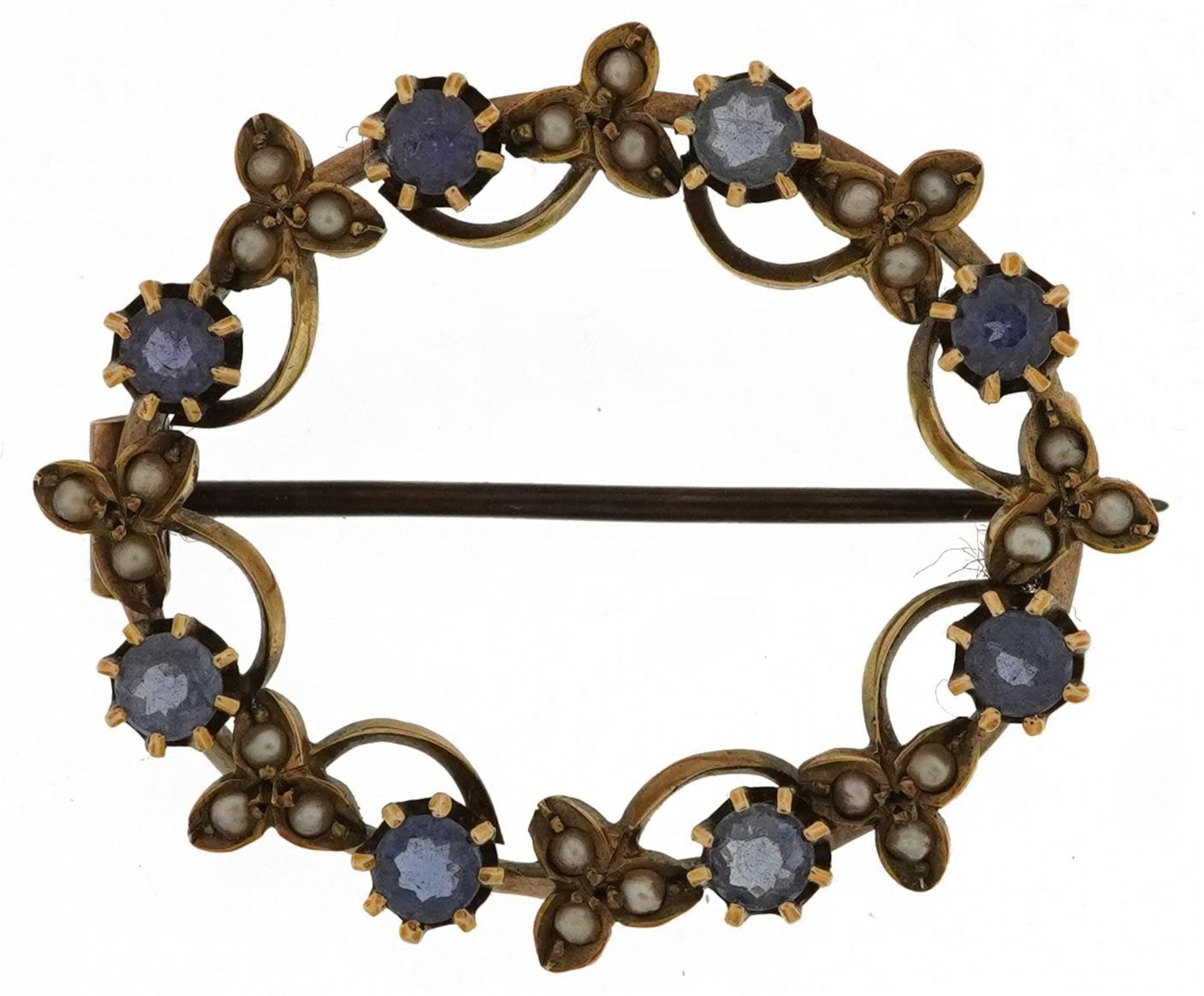 Edwardian 9ct gold sapphire and seed pearl floral brooch, 3.2cm wide, 4.3g : For further information