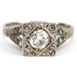 Art Deco 18ct white gold and platinum diamond ring with pierced shoulders, the central diamond