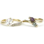 10ct gold white sapphire crossover ring and gold amethyst and blue topaz crossover ring with