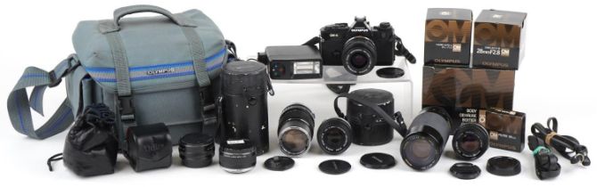 Canon OM-4 camera with various lenses and accessories, some with boxes : For further information