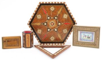 Islamic woodenware including a vizagapatam style frame housing a panel housing a panel with polo