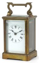 French brass cased carriage clock with enamelled dial having Roman numerals, 11cm high : For further