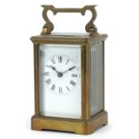 French brass cased carriage clock with enamelled dial having Roman numerals, 11cm high : For further