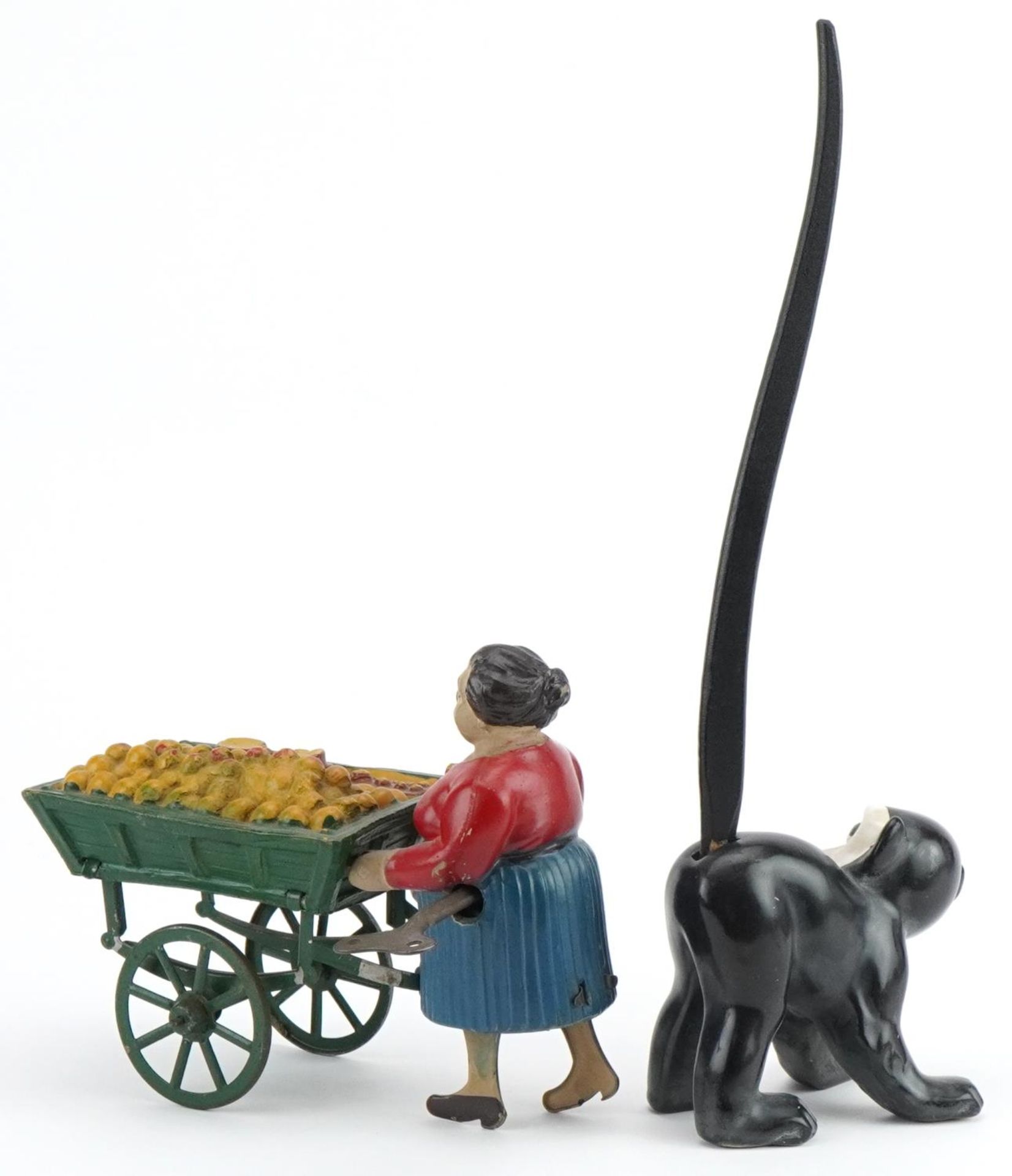 Vintage clockwork street trader and a novelty porcelain monkey with wagging tail, the largest 24cm - Bild 2 aus 4