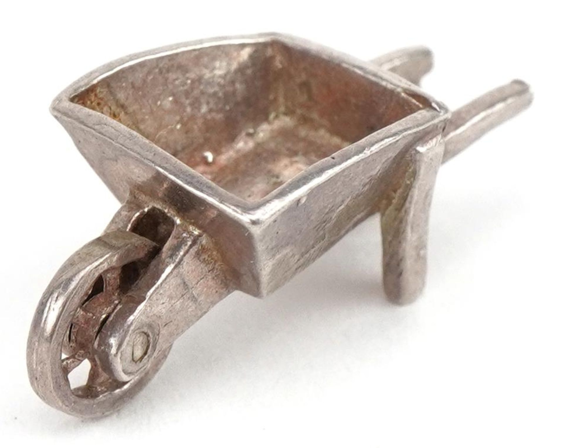 Unmarked silver wheelbarrow charm, 2.1cm in length, 2.5g : For further information on this lot