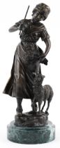 After Louis & Francois Moreau, large patinated bronze statuette of a shepherdess with sheep,