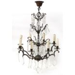 Bohemian style bronzed eight branch chandelier with cut glass drops, approximately 68cm high : For
