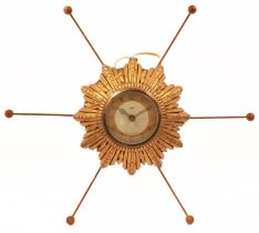 1970s Smith Sectric sunburst wall clock with circular dial having Arabic numerals, overall 43cm in