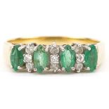 18ct gold emerald and diamond ring set with nine diamonds, size O, 3.8g : For further information on