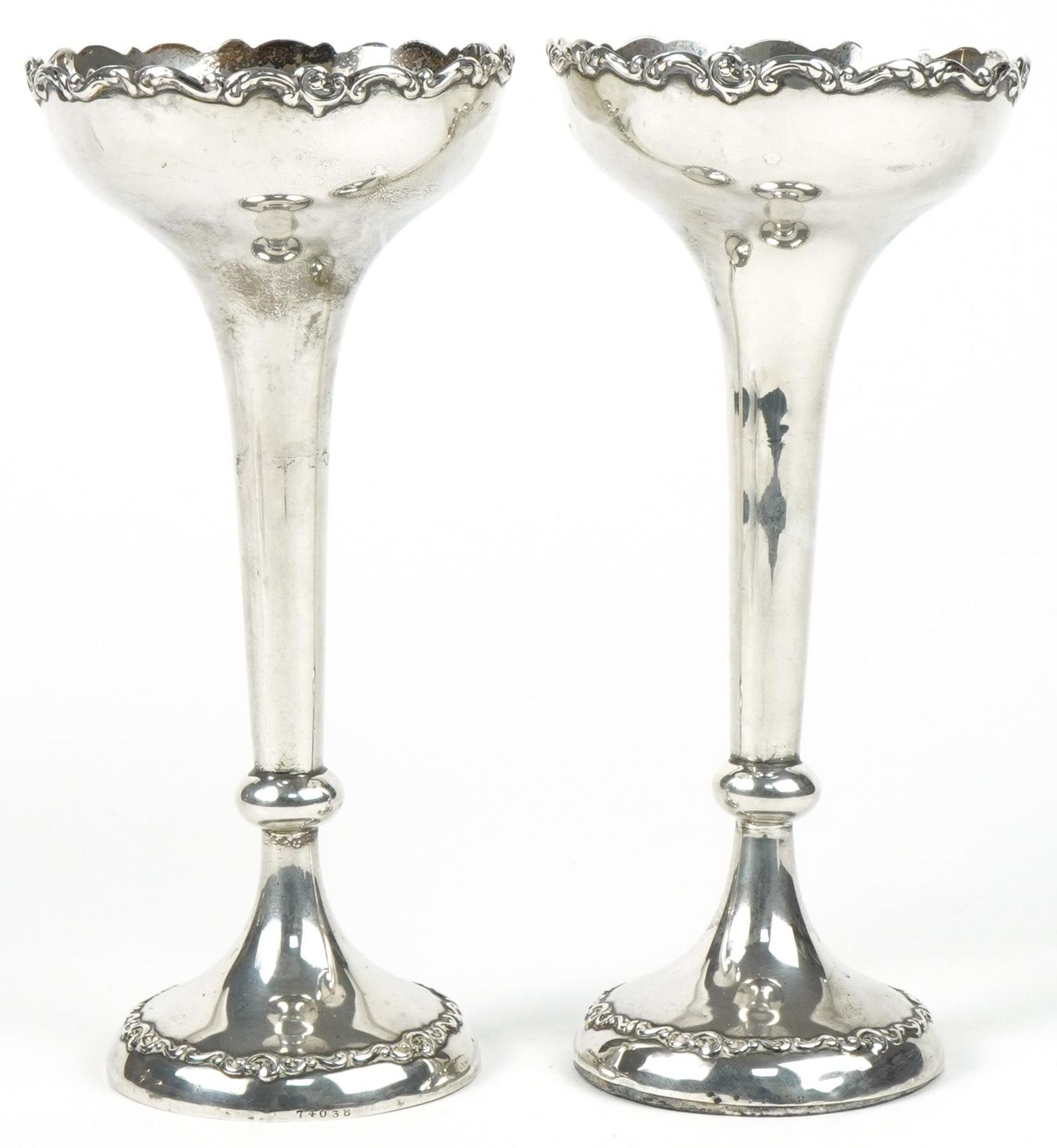 Horace Woodward & Co Ltd, pair of Arts & Crafts weighted silver tapering candlesticks with foliate