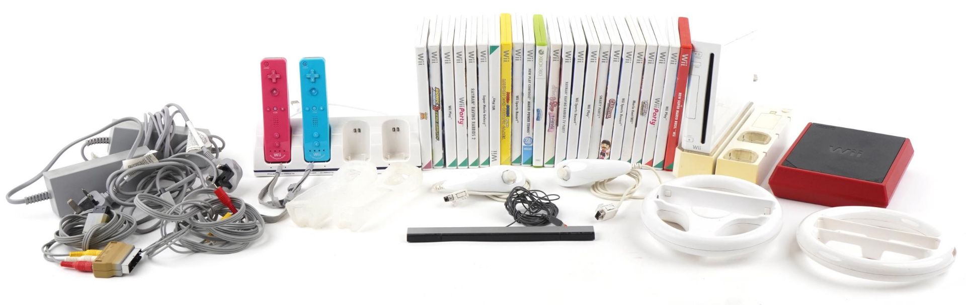 Two Nintendo Wii games consoles including Wii Mini, with controllers, accessories and a collection