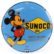 Automobilia interest Sunoco Oil convex enamel advertising sign with Mickey Mouse, 30cm in diameter