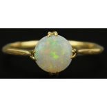 18ct gold cabochon opal ring, indistinct hallmarks, the opal approximately 7.40mm in diameter x 2.