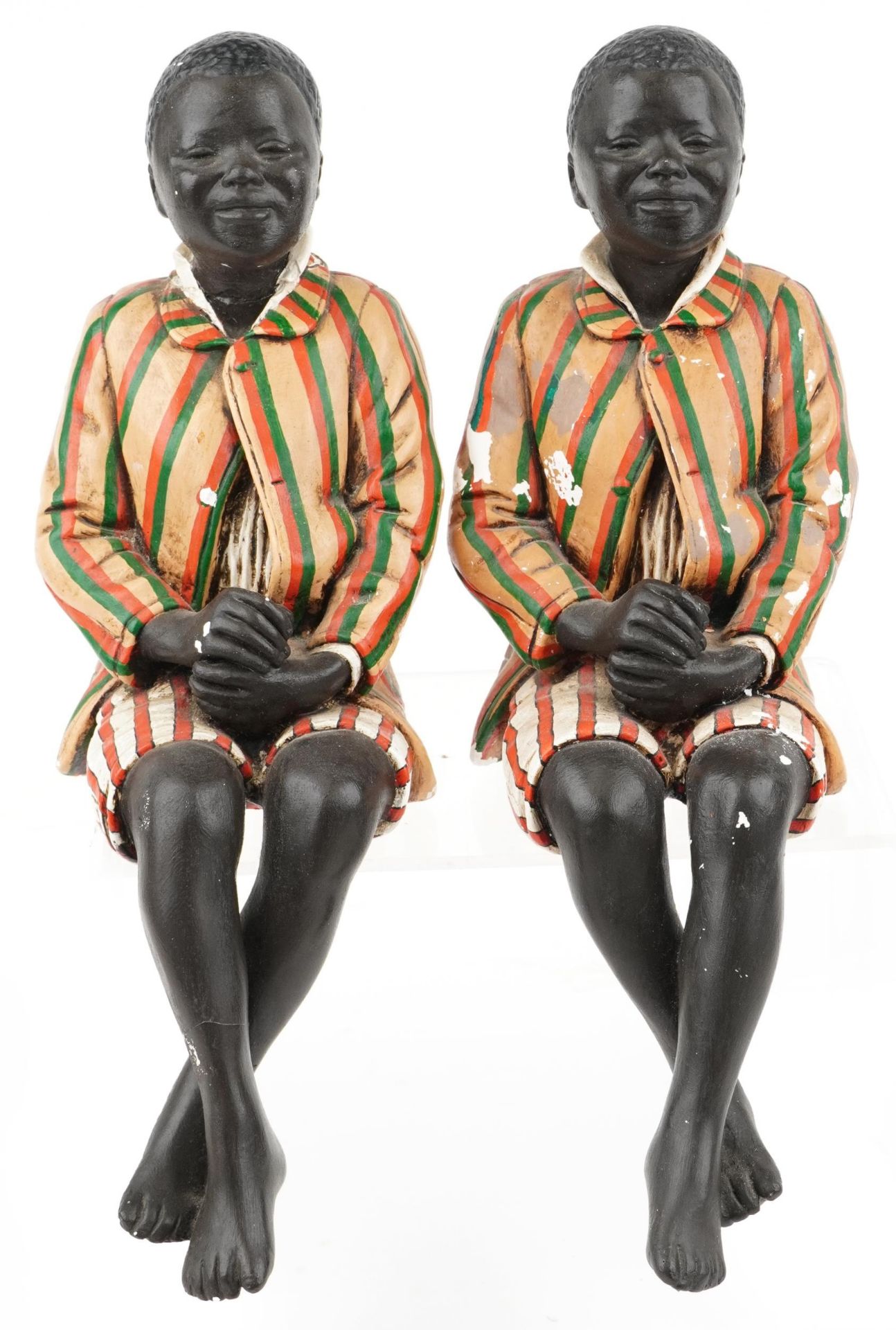 Pair of hand painted plaster bookends in the form of Blackamoors, each 46cm high