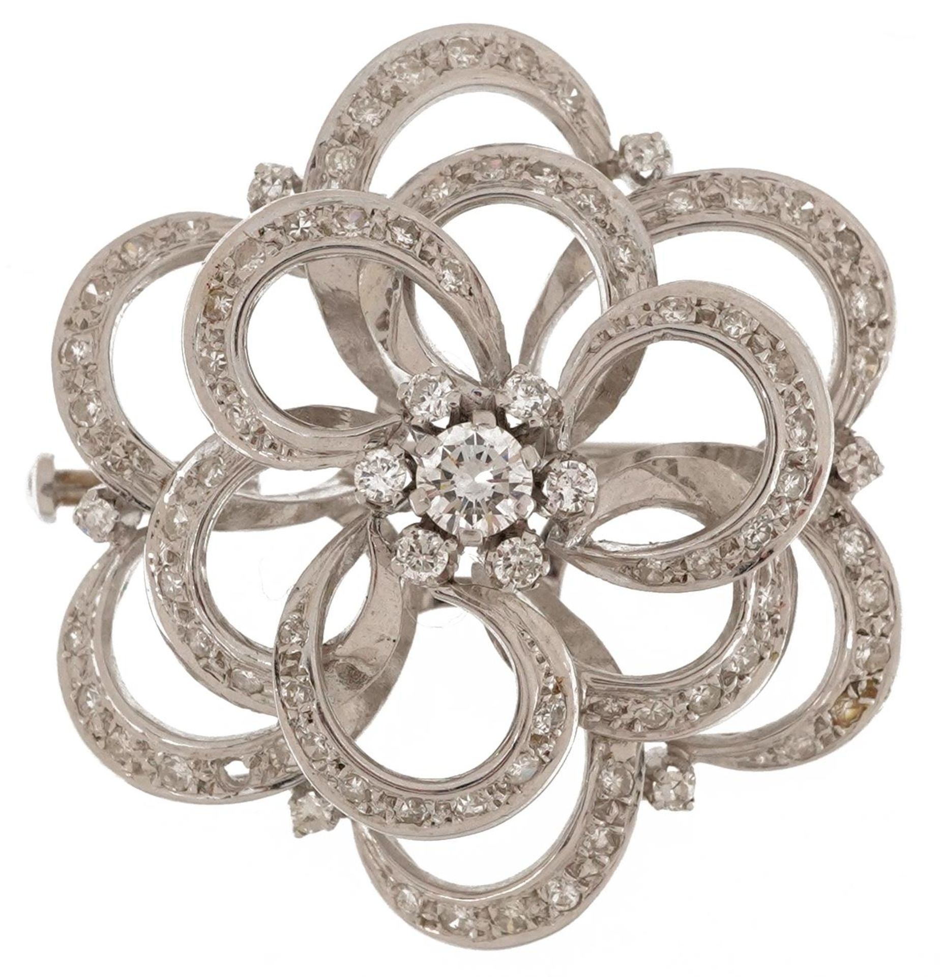 18ct white gold diamond four tier open flower head brooch, the central diamond approximately 0.25ct,