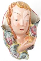 Goldschneider, Austrian Art Deco pottery figural wall pocket of a young female holding an apple,