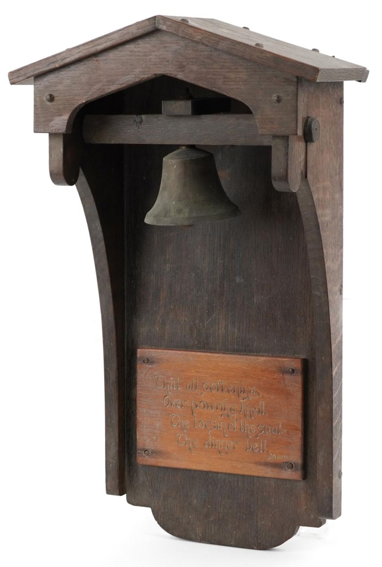 Arts & Crafts oak dinner bell with applied plaque having incised Byron motto, 53cm high
