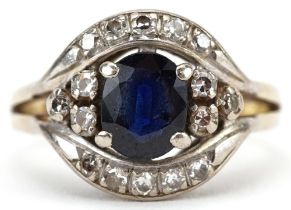 14ct gold sapphire and diamond cluster ring set with a central sapphire surrounded by sixteen