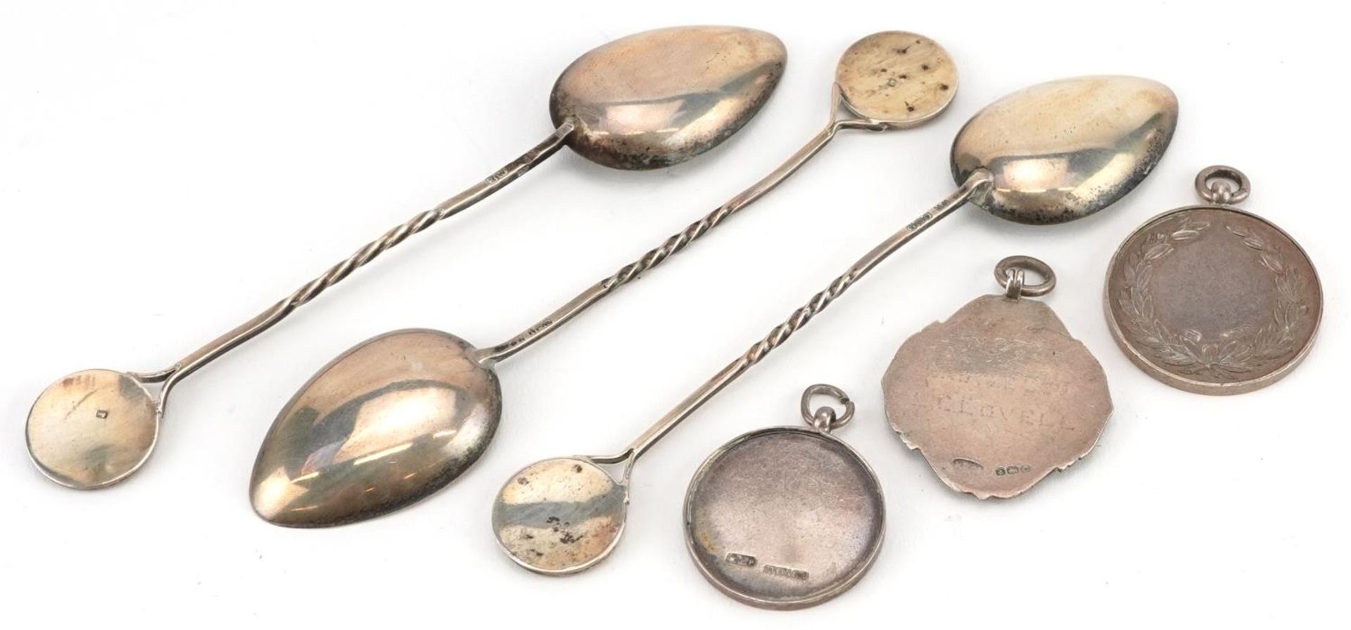 Silver motorcycling interest objects comprising three sports jewels and three teaspoons, the - Image 2 of 3