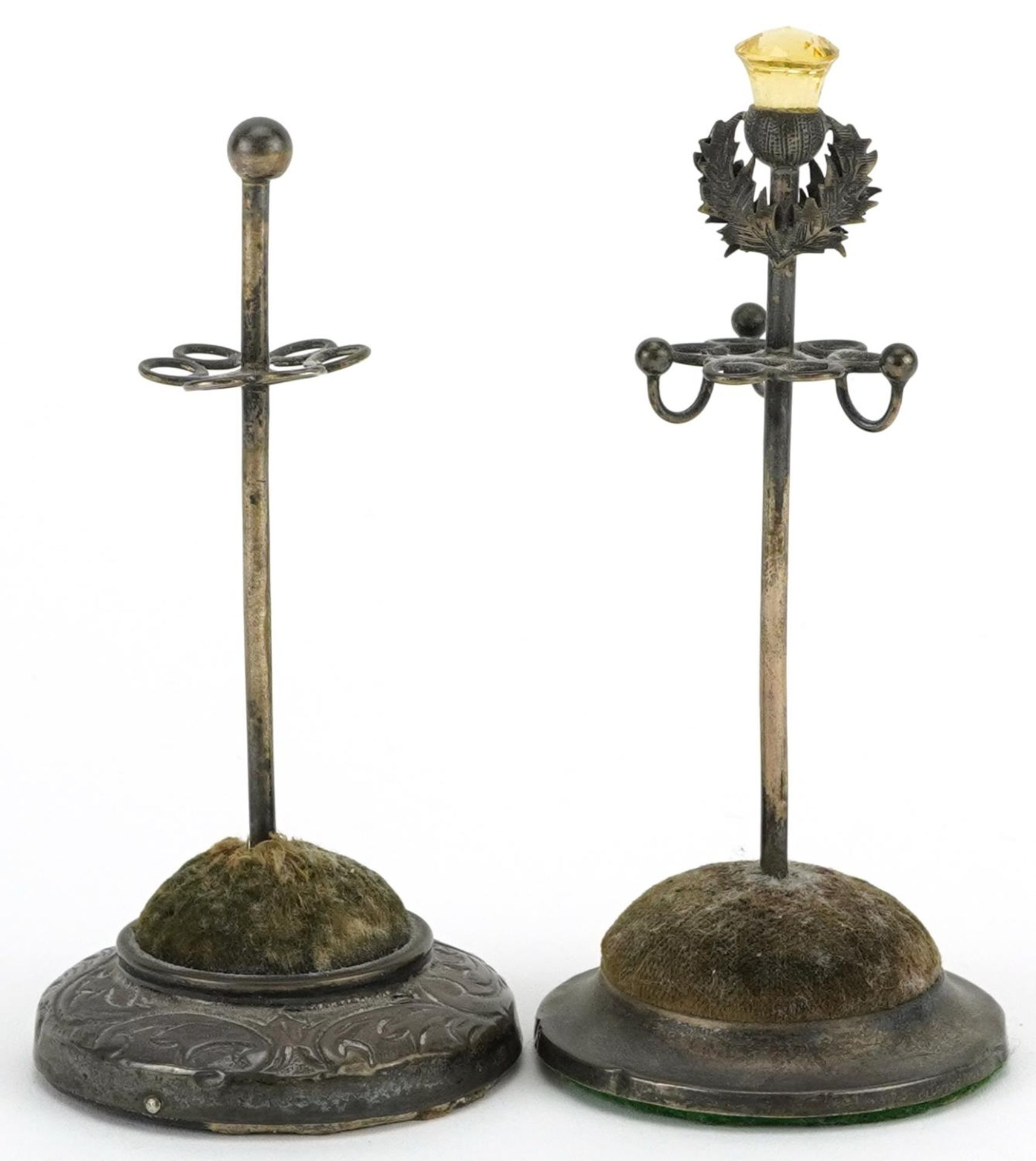 Two Edwardian silver hatpin stands, one with Scottish thistle citrine terminal, the largest 11.5cm