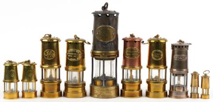 Ten miner's lamps including Thomas & Williams type no 2, various plaques, the largest 26cm high