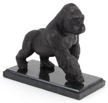 Patinated study of a gorilla raised on a black marble base, 20cm in length