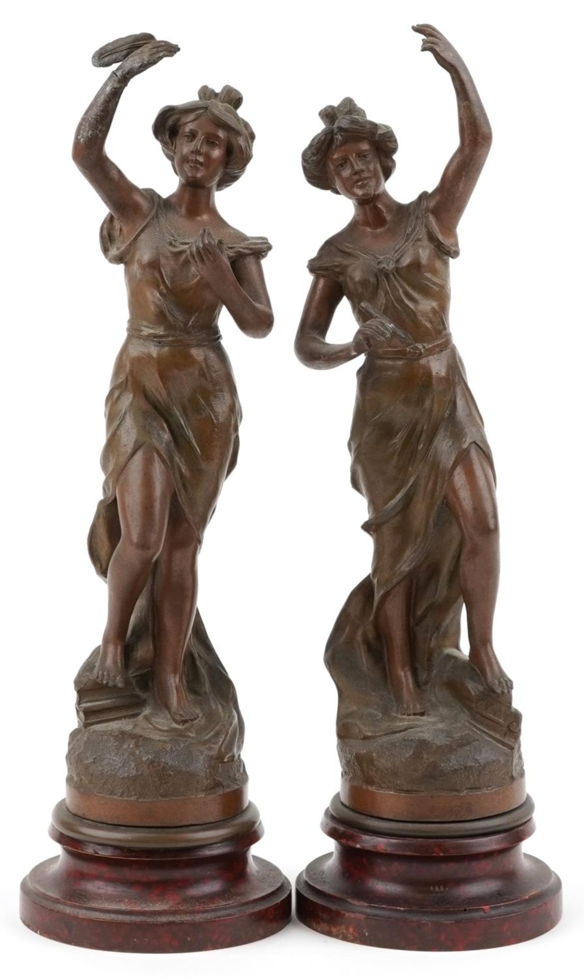 After Charles Ruchot, pair of classical French patinated spelter statues raised on faux rouge