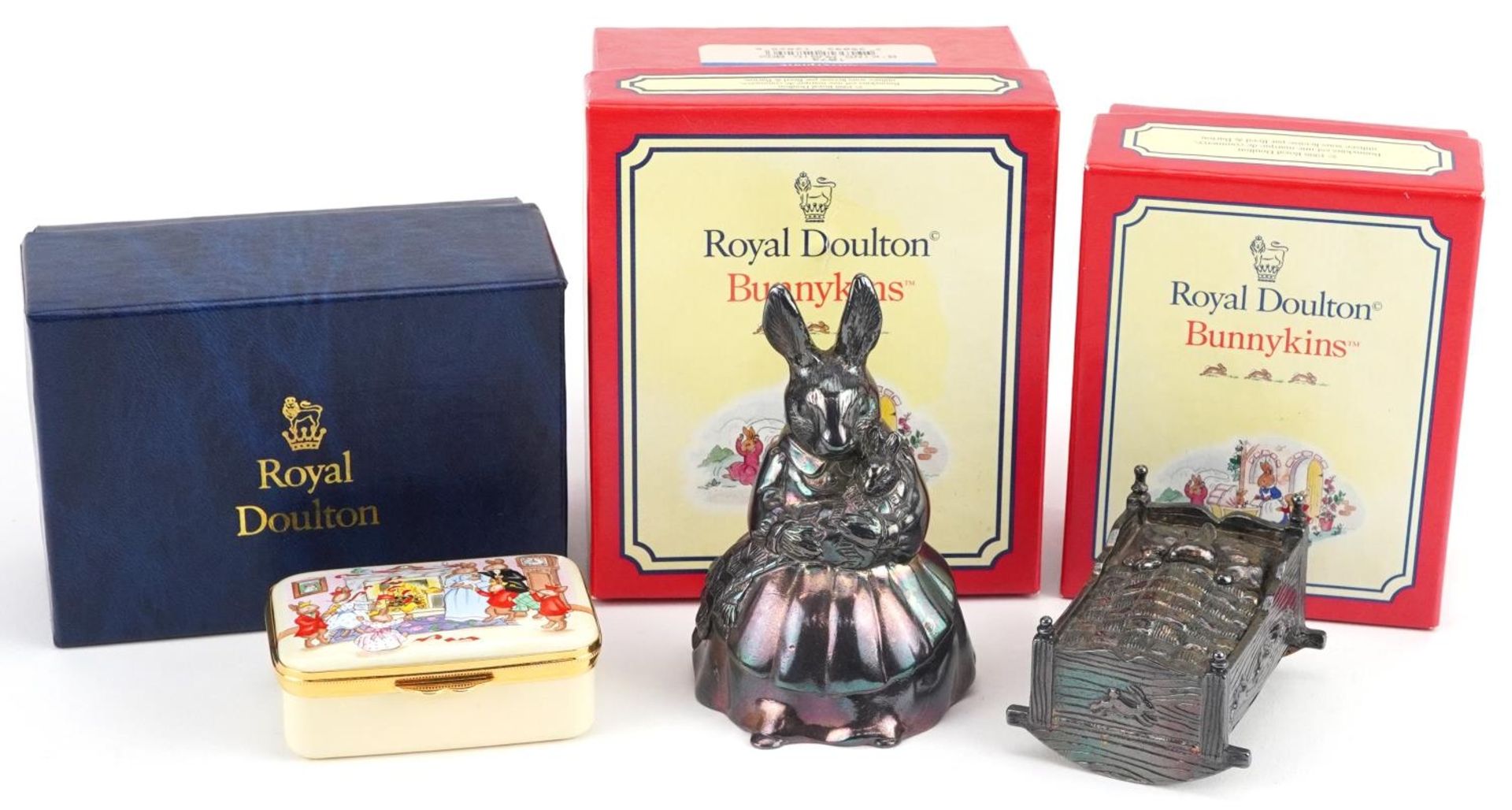 Two Royal Doulton Bunnykins musical boxes and a Royal Doulton enamelled box commemorating the