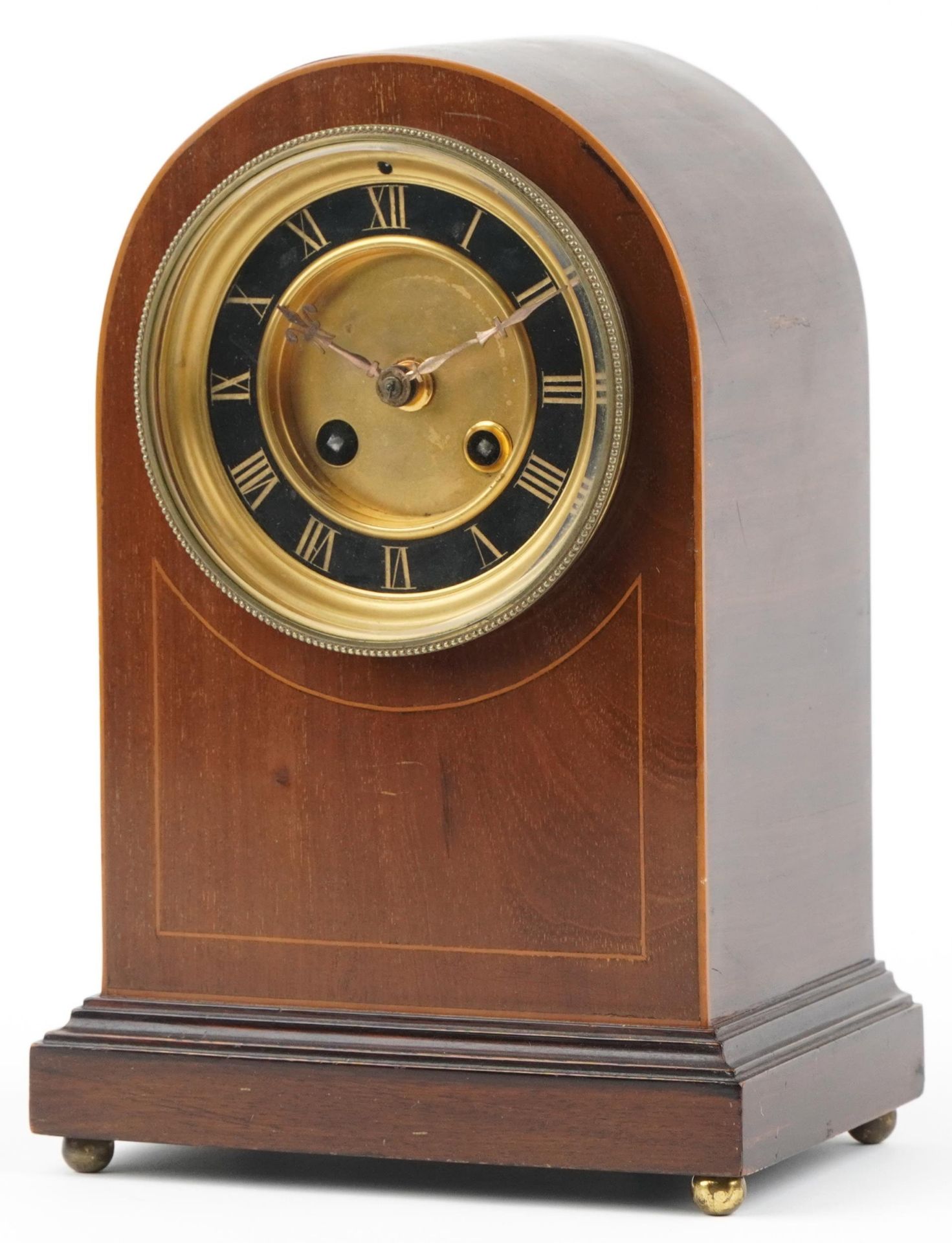 Edwardian inlaid mahogany dome top mantle clock with painted chapter ring having Roman numerals,