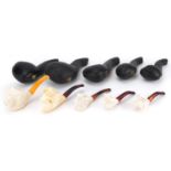Five smoking interest block Meerschaum pipes including examples with nude female and dog's head
