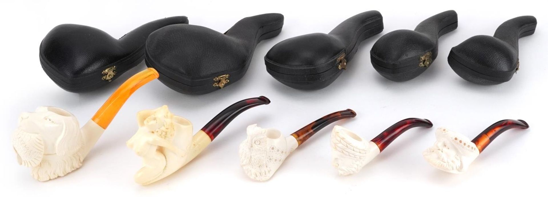 Five smoking interest block Meerschaum pipes including examples with nude female and dog's head