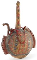 Islamic vellum flask hand painted with stylised floral motifs, 35cm high